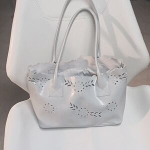 This post is for Furla Beige Leather Floral Cut Out Removable Lining Pouch Shoul